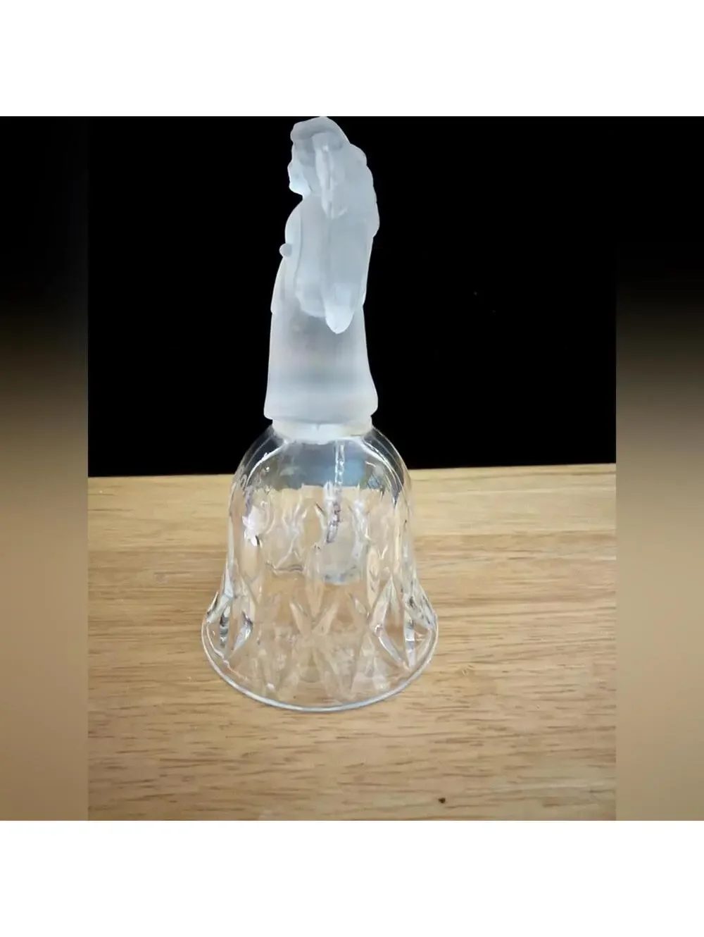 vintage frosted angel sits atop a crystal bell etched with the year 2001.